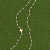 White Cross Necklace by Gigi Clozeau